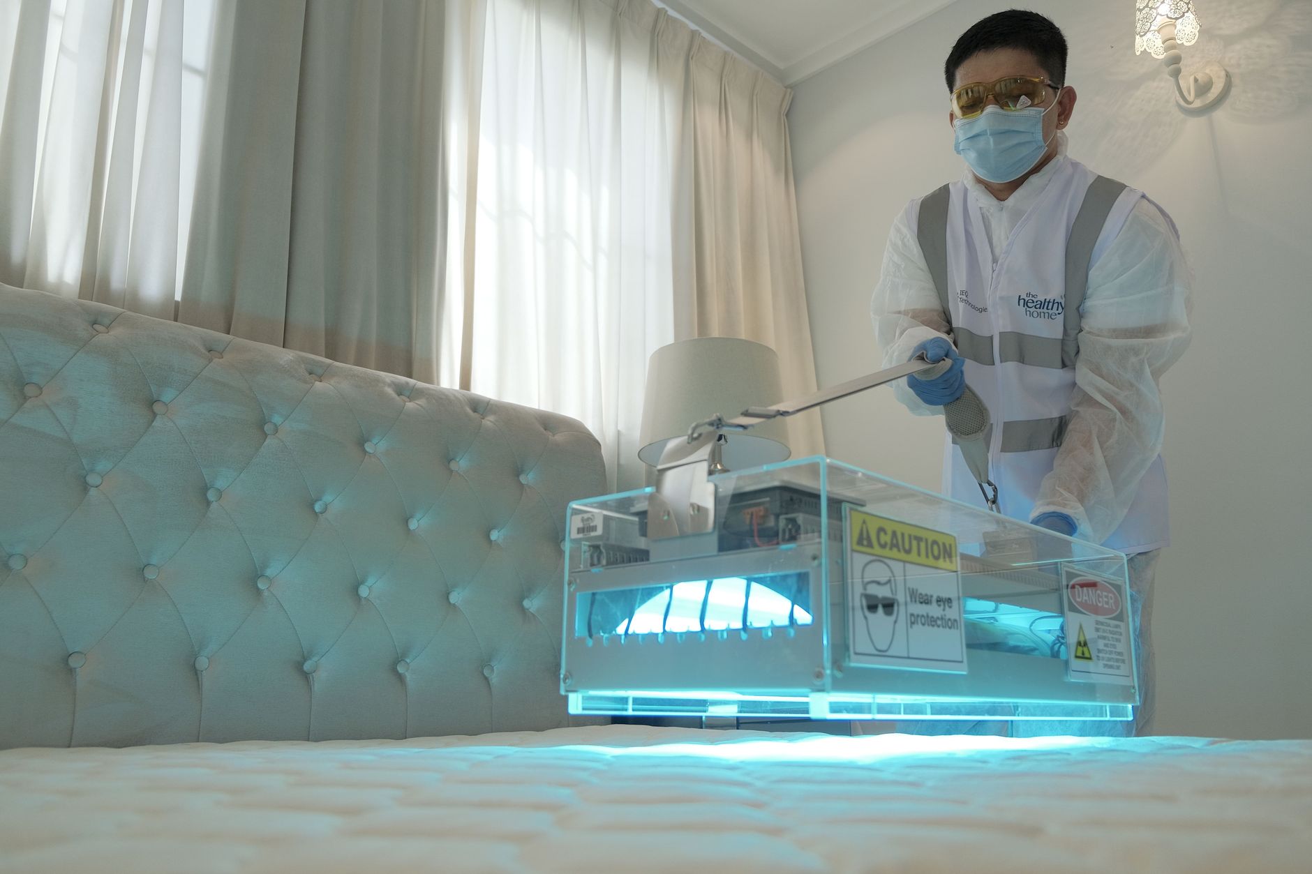 A professional mold remediation team from Tech Pro Mold Removal setting up containment barriers inside a McKinney home, demonstrating meticulous care and safety protocols.